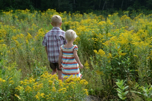 henry and Nola Mae in yellow weeds