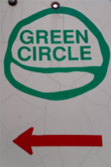 frugal sisters green circle sign a